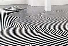 a room with black and white lines on the floor