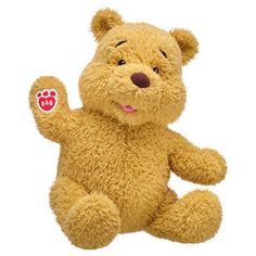 a brown teddy bear with paw prints on it's left hand and eyes closed