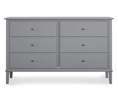 a grey dresser with six drawers