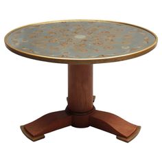 a round table with an intricate design on the top