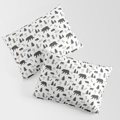 two black and white pillows with bears on them