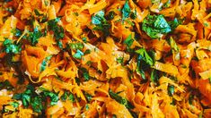 a close up view of some food that is made with carrots and parsley