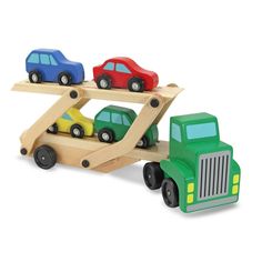 a toy car carrier with three cars on it