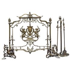 an ornate metal bed frame with four posts and two vases on each side,