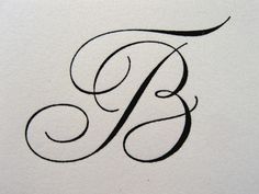 the letter b is in cursive writing with black ink on a white paper