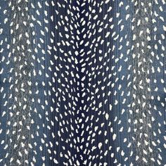 an abstract blue and white pattern on fabric