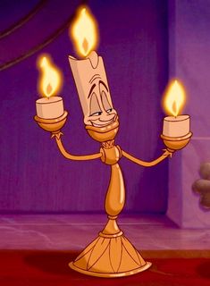 a cartoon character holding two candles in their hands