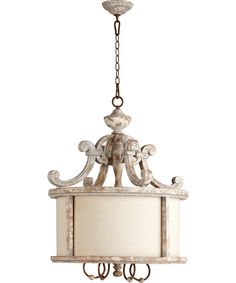 an elephant lamp hanging from a chandelier with a white shade on the bottom