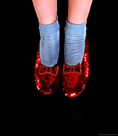 the legs and feet of a woman wearing red sequins with blue tights