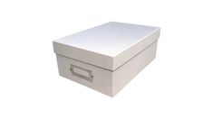 a white box that is open and sitting on top of a table with the lid closed