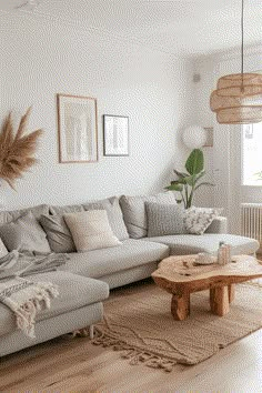 a living room filled with lots of furniture and decor on top of a wooden floor