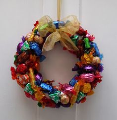 a candy wreath hanging on the front door