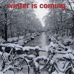 there are many bikes that are covered in snow and the words winter is coming above them