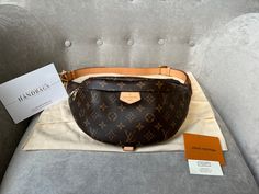 Overview Louis Vuitton Bum Bag in Canvas Monogram with gold hardware. Fashioned in classic Monogram canvas and signed with a “Louis Vuitton Paris” leather patch, this uber-functional bumbag transforms sportwear into the very definition of casual chic. Wear it as a belt bag, cross-body or over the shoulder for a jauntier look. Now discontinued this item is highly sought after. Features Monogram coated canvas Gold hardware Smooth cowhide leather trim Cotton canvas lining 1 main compartment with double zip closure 1 adjustable belt and top handle 1 D ring 1 natural cowhide leather patch Condition Exterior: Excellent condition with only light signs of wear. Minor marks to leather belt / strap. Slight wrinkling to strap. Interior: Excellent condition with minor marks. Hardware: Excellent condit Louis Vuitton Bum Bag, Louis Vuitton Bumbag, Louis Vuitton Paris, Classic Monogram, Bum Bag, Vuitton Bag, Adjustable Belt, Sierra Leone, Leather Patches