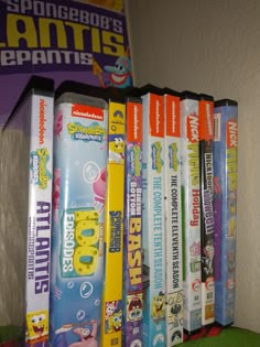 several children's books are lined up on a shelf