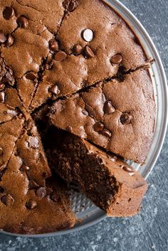 a chocolate cake on a plate with one slice cut out