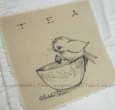 a drawing of a bird in a teacup on a piece of white paper with the words tea written across it