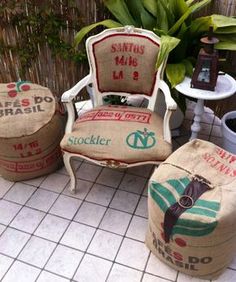 three chairs and two stools sitting on a tile floor next to a potted plant