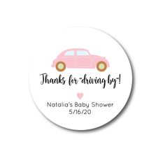 a pink baby shower sticker with the words thanks for driving by