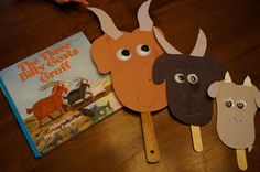 the three billy goats cut out from popsicle sticks with a book on top of them