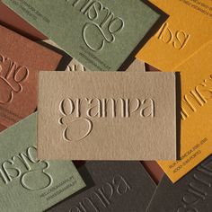 several business cards with the word gramma printed on them, all in different colors