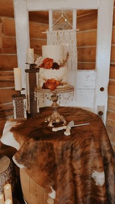 a table topped with a cake and candles