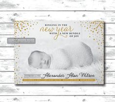 the new baby announcement card with gold confetti