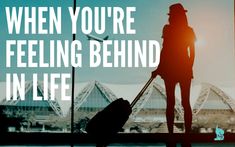 a woman standing in front of an airport window with her luggage and the words when you're feeling behind in life