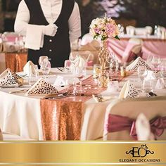 a man in a tuxedo standing next to a table with pink and gold decorations