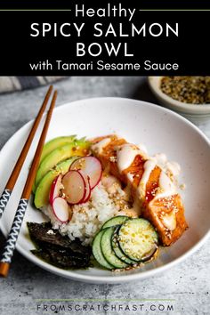 healthy spicy salmon bowl with tamari sesame sauce and cucumber on the side