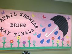 a bulletin board with an umbrella and flowers on it