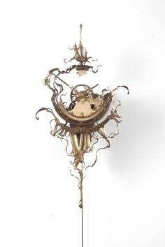 an ornate clock is on display against a white background