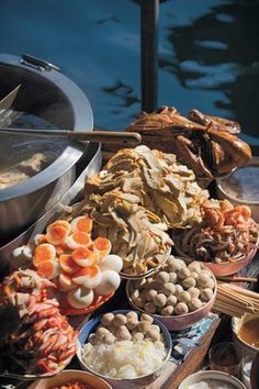 an assortment of food is on display in bowls