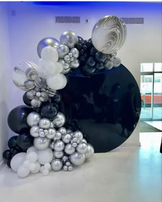 an art piece made out of balloons in a room