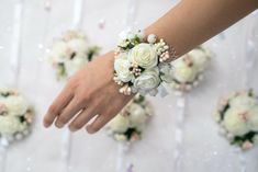 a bride's bouquet is being held by her grooms hands on the wedding day