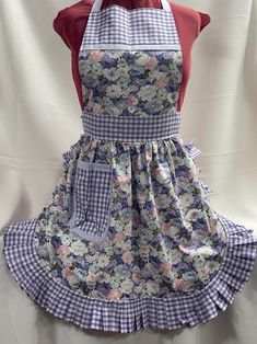 the apron is made out of fabric and has flowers on it