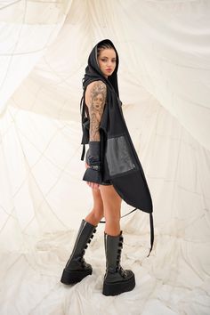 Black Alternative Vest For Fall, Alternative Style Black Vest For Fall, Alternative Black Vest For Fall, Sleeveless Cotton Outerwear For Festivals, Punk Sleeveless Outerwear For Streetwear, Punk Style Winter Vest For Streetwear, Punk Style Vest Outerwear For Fall, Black Cotton Outerwear For Festivals, Alternative Black Fall Vest