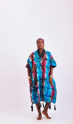 Introducing our exquisite one-size-fits-all kaftan-style dress, where comfort meets artisanal elegance. Each piece is meticulously crafted from luxurious handcrafted tie-dye adire fabric, ensuring a unique and captivating look for every wearer. Embrace the relaxed silhouette of this loose-fitted dress, offering both comfort and style in equal measure. Whether you're lounging by the pool or exploring the city streets, this versatile piece effortlessly transitions from day to night with effortless grace. Indulge in the sumptuous feel of handcrafted tie-dye adire fabric, renowned for its softness and luxurious texture, ensuring you feel as fabulous as you look. Each dress is a testament to the rich cultural heritage and skilled craftsmanship of West Africa. Designed to flatter all body types, Adire Fabric, Kaftan Style Dresses, Kaftan Style, Dress Drape, Loose Fitting Dresses, Cultural Heritage, Bag Dress, West Africa, City Streets