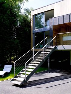 a modern house with stairs leading up to it