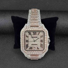 Iced Out Cartier Watch From Santos De Cartier Collection - A Genuine Luxury Timepiece Meticulously Embellished with Premium Quality Sparkling Round Cut White Moissanite Diamonds in Stainless Steel Metal, Features Automatic Swiss ETA Analogue with Date Indicator, 40 mm Square Moissanite Diamond Studded Dial with Roman Numericals And 14k White and Rose Gold Two Tone Rhodium Plated Smartlink Bracelet Strap. Cartier Diamond Watch, Square Diamond Studs, Skull Engagement Ring, Couples Wedding Bands, Vintage Inspired Rings, Wrist Wear, Cartier Watch, Mother Rings, Luxury Timepieces