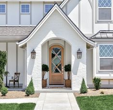 a white house with a wooden front door