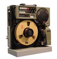 an old movie projector sitting on top of a wooden stand next to a white wall