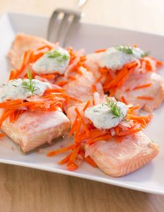 salmon with carrots and cream cheese on a white plate