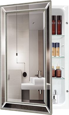 a bathroom with a sink, mirror and shelves