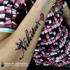 a woman with a tattoo on her arm that says, melon and has hearts in it