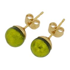 These fun and stylish Murano Glass earrings represent the mastery and beauty of authentic Murano Glass craftsmanship. Their gorgeous deep herb green color set against shimmering genuine 24kt gold foil embedded in the glass creates a dazzling magical impression and makes them an ideal compliment to a variety of outfits and occasions Measurements: Each Murano stud earring measures about 1/4 inch in diameter. The pins are made of gold-plated surgical steel for all day allergy-free comfort. Our Mura Gold Glass Earrings For Pierced Ears, Formal Gold Glass Earrings, Elegant Gold Glass Earrings, Gold Murano Glass Jewelry Gift, Elegant Multicolor Murano Glass Jewelry, Elegant Green Murano Glass Necklace, Nickel-free Green Glass Earrings, Murano Glass Earrings, Elegant Gold Murano Glass Earrings