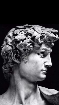 the head and shoulders of a statue of a man with curls on it's hair