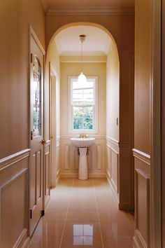 the hallway is clean and ready to be used as a bath room or office space