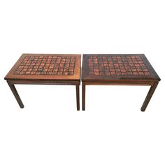 two tables made out of wood and tile on each side, one with a square top