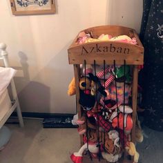 a wooden crate filled with lots of stuffed animals